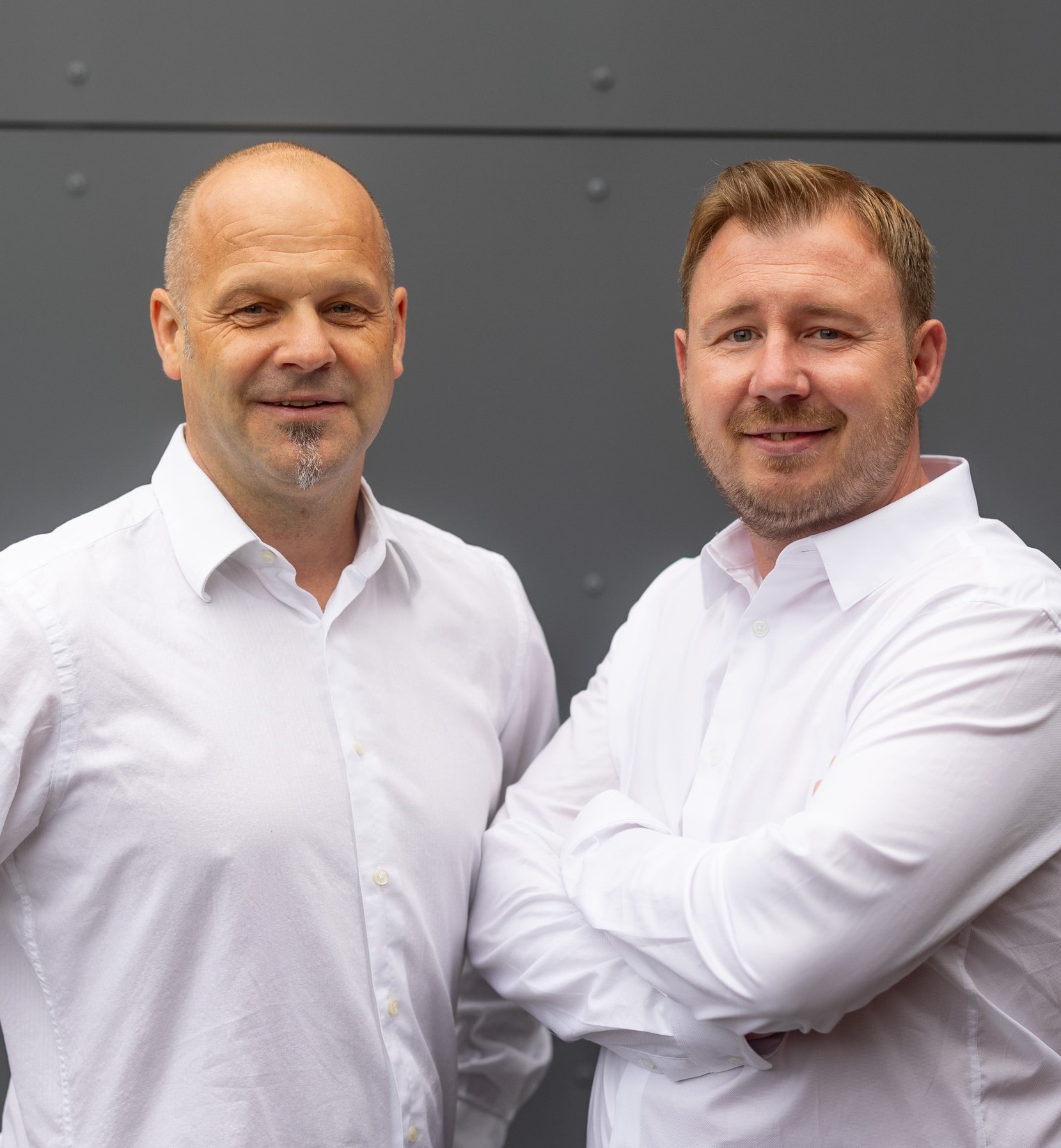 two men in white shirts